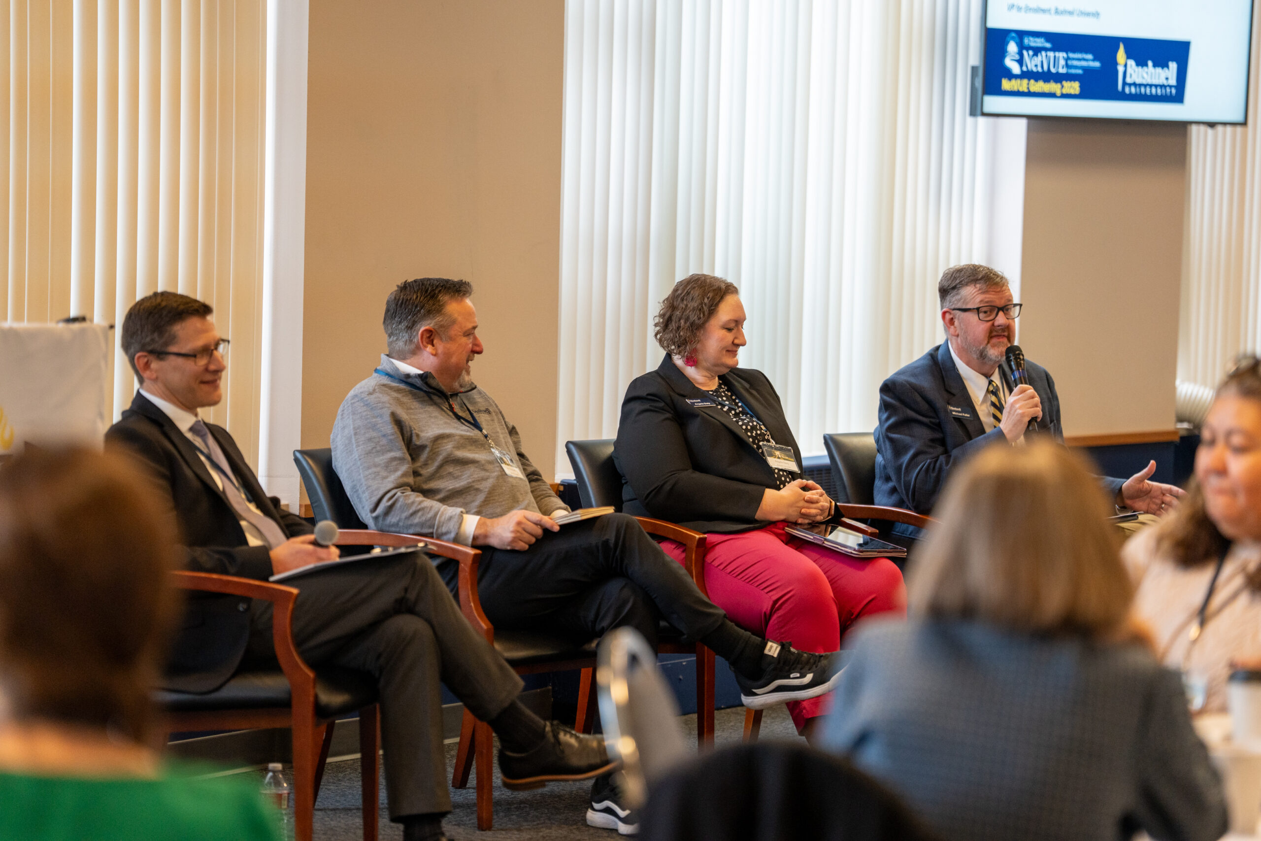 A panel of speakers presenting during the NetVUE regional gathering hosted by Bushnell University, 